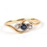 A yellow metal (tests as 18ct gold) diamond and sapphire ring, approx UK size 'M'.