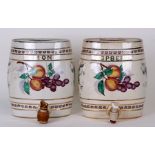 Two pottery spirit barrels, Lemon and Raspberry, each decorated with fruit, each 21cms (8.25ins)