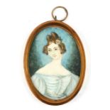 A portrait miniature depicting a young lady wearing a grey dress, in the Georgian style, 4.5 by 6.