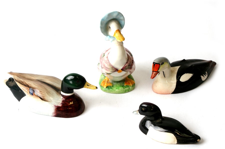 Three Beswick Approved by Peter Scott birds comprising a Kin Eider, a mallard (beak glued), a tufted