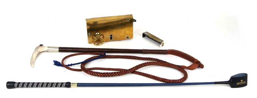 A Moss Bros Covent Garden leather whip with antler handle, a Mountford riding crop, brass door