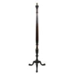 An early 20th century mahogany carved standard lamp on a tripod base, 168cms (62ins) high.