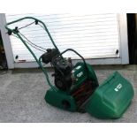 A Suffolk Punch petrol cylinder mower with 40cms (16ins) cut, instructions and original bill of sale