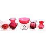 A Victorian cranberry glass milk jug; together with four other cranberry glass items (5).