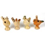 A group of four pottery whistles, three in the form of birds and one in the form of a pig, the