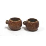 A pair of Chinese brown glazed porcelain bird feeders. 3.5cm (1.25 ins) high