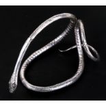 An Indian white metal snake, 12.5cms (5ins) high.