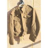 A WW2 British Army Captains Battledress jacket with cloth pips, in a very good condition, it