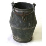 A galvanised metal well bucket.