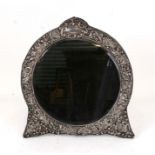 An Edwardian silver framed circular strut mirror engraved 'Buxton Hydro Buxton Fancy Dress Ball