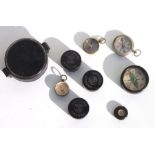 A mid 20th century metal cased large pocket compass 7.5cms (3ins) diameter, together with three