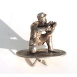 A 19th century solid silver finial (probably from a trophy) of a British Army soldier firing his