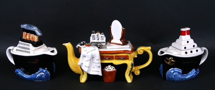 Three Tony Carter novelty teapots, two in the form of ships and one in the form of a dressing