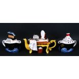 Three Tony Carter novelty teapots, two in the form of ships and one in the form of a dressing