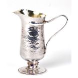 A Guild of Handicraft Arts & Crafts silver cream jug designed by Charles Robert Ashbee, decorated