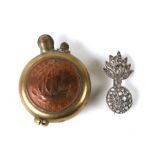 A WWII era trench art style lighter together with a paste set silver grenade brooch (2)