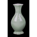 A Chinese pale celadon glazed vase with blue seal mark to the underside, 20cms (8ins) high.Condition