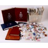 A large quantity of loose stamps; together with two albums containing 1977 Jubilee World issues