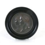 A 19th century lead plaque depicting Napoleon and Josephine in profile, signed 'Andrieu Fecit',