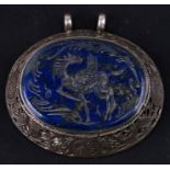 A large Afghanistan white metal and lapis lazuli pendant seal depicting a winged horse, 6.5cms (2.