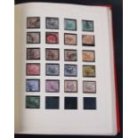 A collection of Malaysia, Straits Settlements and Singapore stamps housed in a Stanley Gibbon