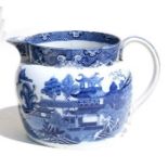 An oversized willow pattern jug. 17cm (6.75 ins) high