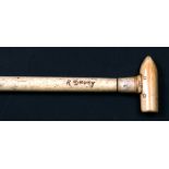 A whalebone walking stick signed 'R Davey' with a later trench art handle in the form of a bullet,