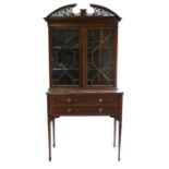 A late 19th century Chinese Chippendale style mahogany bookcase on stand, the pair of astragal
