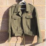 A WW2 British Army Captains Battledress jacket with cloth pips and Divisional patches, in a very