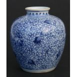 A Chinese blue & white vase decorated with flowers and foliate scrolls, 13cms (5ins) high;