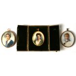 A group of three portrait miniatures, a lady in a blue dress, a lady in a green dress and young