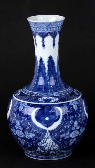 A large Chinese blue & white vase decorated with flowers and dragons, four character blue mark to