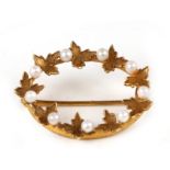 A Victorian yellow metal leaf and seed pearl brooch, 2.5cms (1ins) wide.