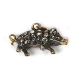 A diamond pig pendant / charm, pave-set overall with graduated round-cut diamonds and ruby eyes,