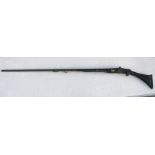 An Arab flintlock long gun with carved decoration to the stock, 166cms (65.5ins) long.