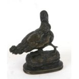 A bronze figure of a chicken, signed 'A Cain', 8cms (3ins) high.