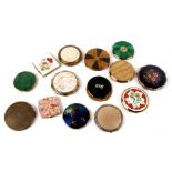 A collection of powder compacts to include enamel and mother of pearl examples.