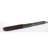 A 19th century brass and mahogany two draw telescope by G. Dixey of London. Engraved G Dixey,