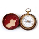 A 19th century gilt metal pocket compass by Bate of London, cased, 4cms (1.5ins) diameter.