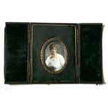 A late 19th century portrait miniature depicting a young girl, in original leather case, 7cms (2.
