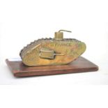 A brass and copper trench art WW1 Tank Inkwell with revolving top turret which unscrews to reveal