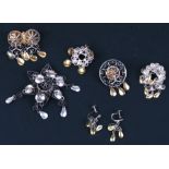 Five Norwegian silver and silver gilt 'Solje' brooches; together with a matching pair of screw