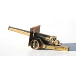 A detailed WW1 trench art brass breechloading Cannon with opening breech and rotating wheels. Barrel