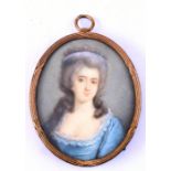 A portrait miniature depicting a lady wearing a blue dress, 5 by 6.5cms (2 by 2.5ins).