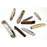 A group of pocket knives to include silver and mother of pearl examples.