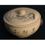 A Chinese Yixing pot and cover decorated with a bird amongst prunus, with calligraphy to the side,