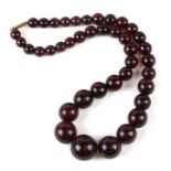 A cherry amber Bakelite like bead necklace.