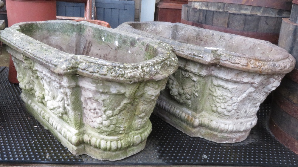 2 LARGE DECORATIVE CONCRETE PLANTERS