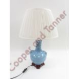 A Chinese blue glazed vase, converted to a lamp standing on a wooden base, 37cm high