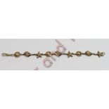 A 9 carat gold bracelet, with links cast as shells and star fish, 19.5cm long, 29 g gross
